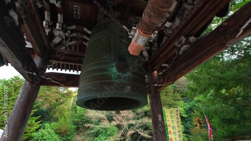 Bonshō - Large bell and suspended wooden beam on Miyajima. photo