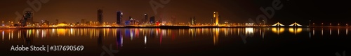 Panoramic view of Bahrain skyline at night with iconic buildings, December 24 2019, Manama, Bahrain
