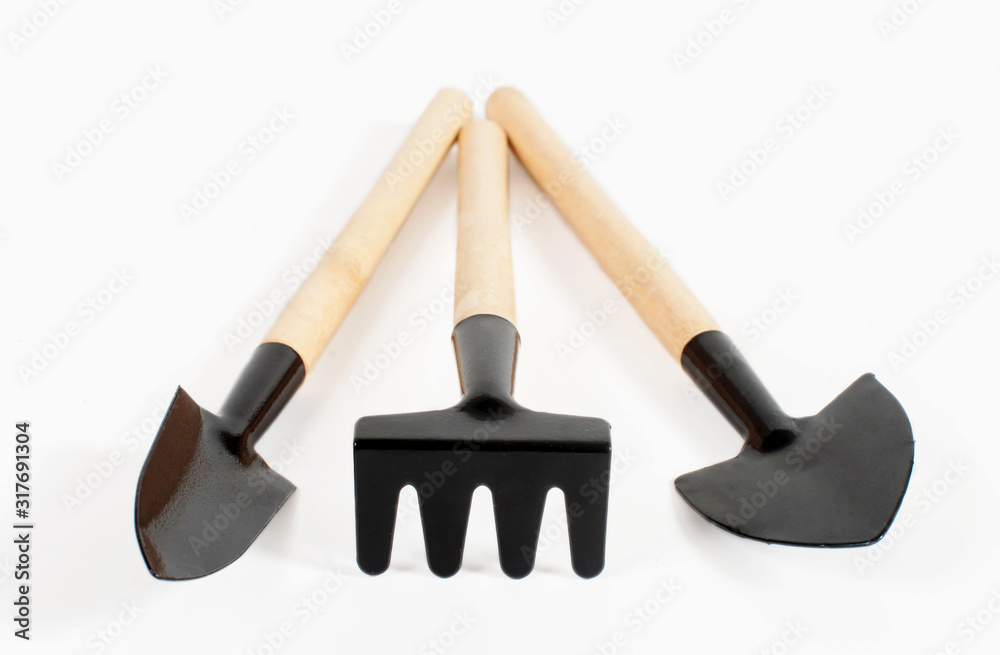 Various small gardening tools close-up on a white background Various small gardening tools close-up on a white background