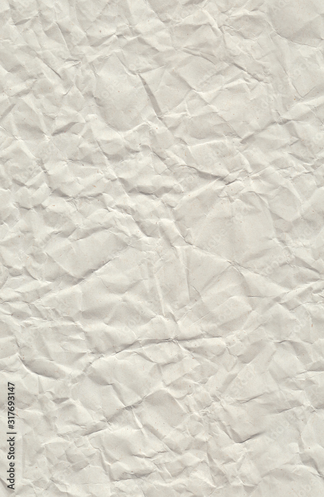 Obraz premium Very wrinkled recycled paper. Seamless pattern with a crumpled recycled paper texture and stretched again.