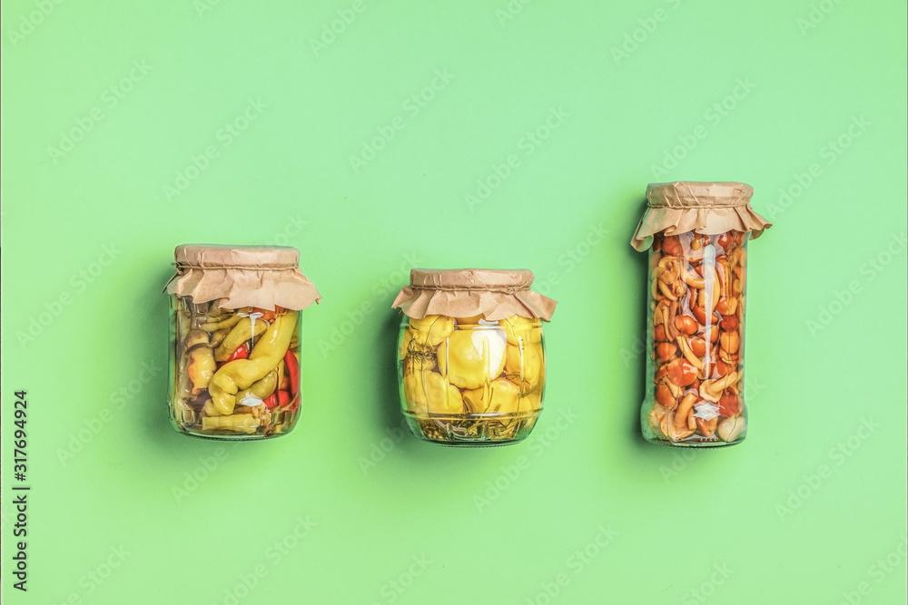 Pickled vegetables blanks on a green background. Pickled vegetables blanks on a green background.