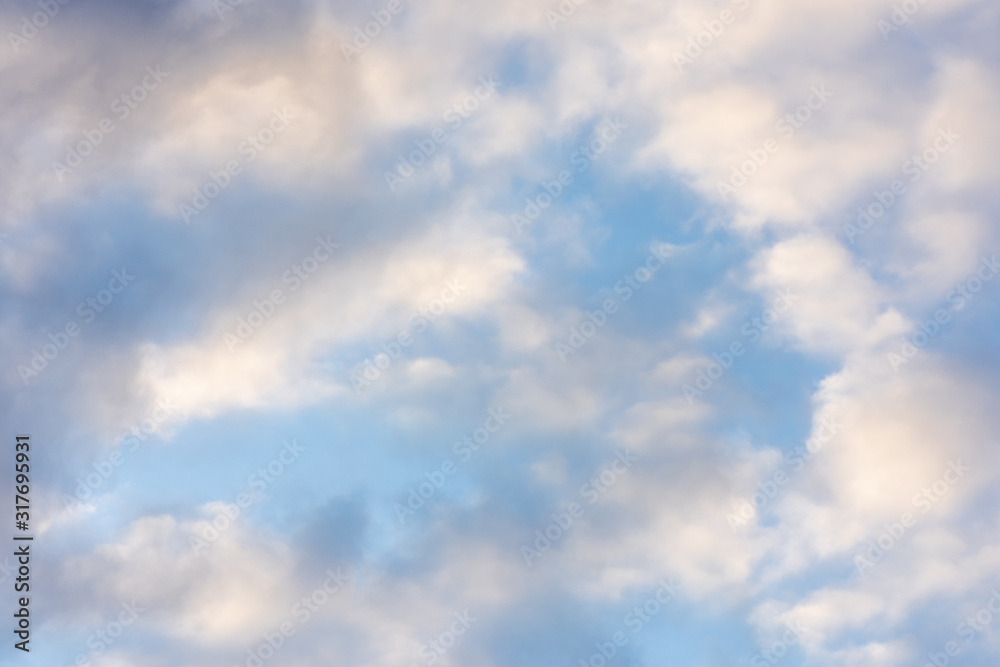 bright sky with clouds and glare from the sun's rays bright sky with clouds and glare from the sun's rays