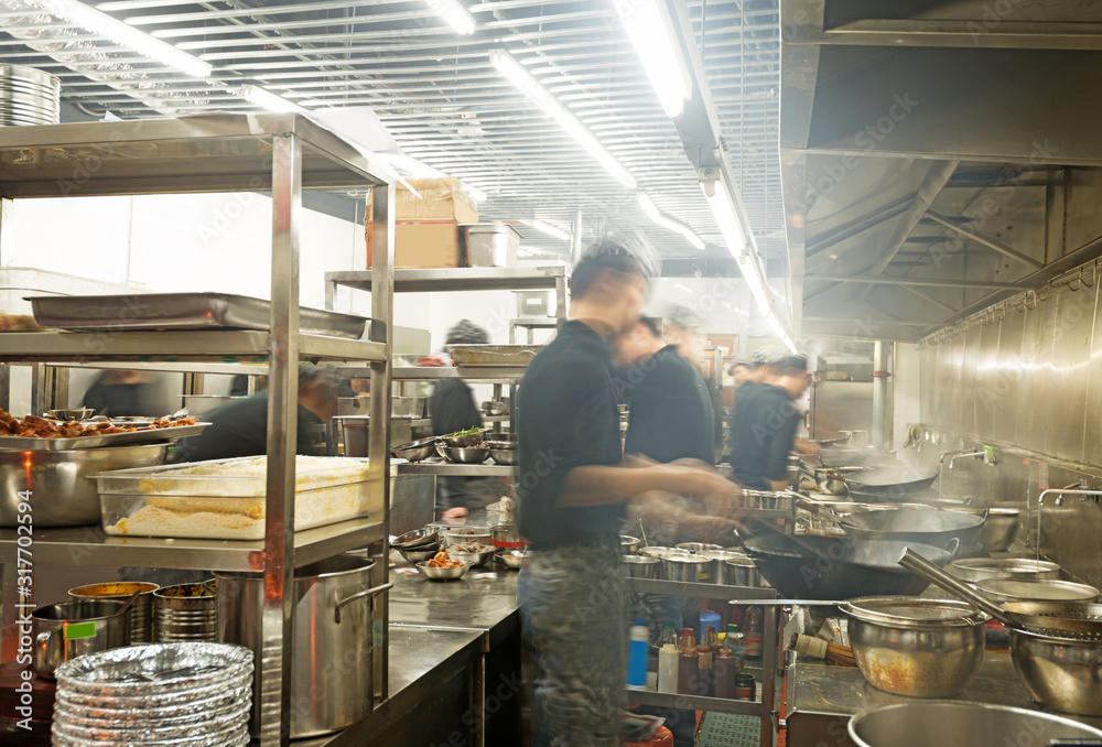 motion chefs of a restaurant kitchen motion chefs of a restaurant kitchen