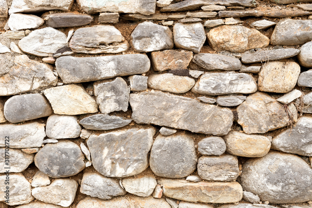 The texture of the stone wall close-up The texture of the stone wall close-up