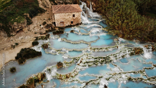 Quadro su tela The famous ancient baths of Saturnia in Tuscany, which descend in a cascade of p