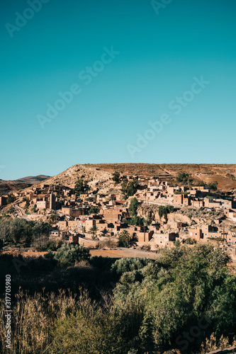 The Berber village of Asni comprised of clay houses built on a hillside in the foothills of the Atlas Mountains