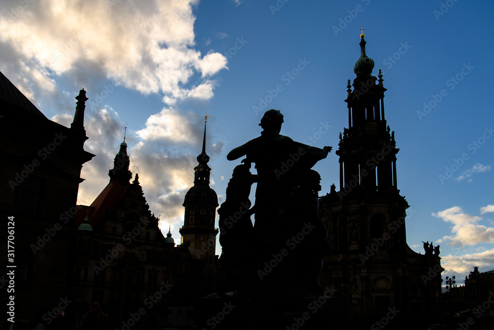 Obraz premium Silhouettes of Dresden Cathedral of Trinity Hofkirche and Dresden Castle Hausmannsturm. Dresden, Germany. November 2019