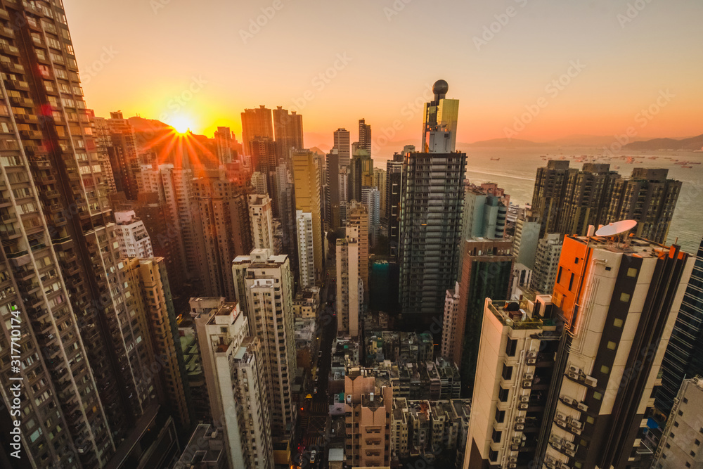 modern city skyline, skyscraper and sunset sky over Hong Kong