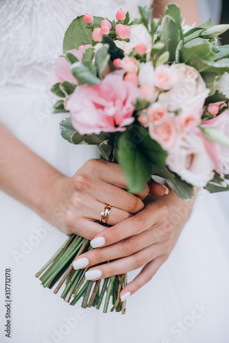 beautiful wedding bouquet with red, pink and white flowers, roses and eucalyptus, peonies, calla lilies