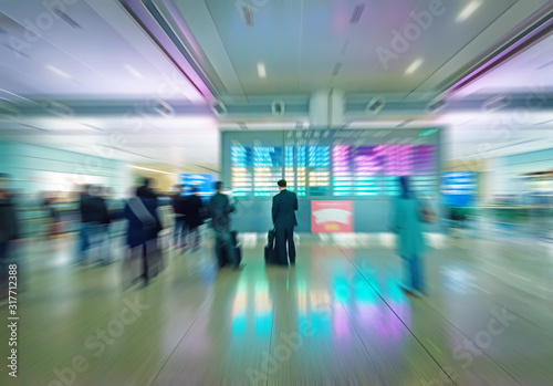 Passengers in Shanghai Pudong Airport; Motion Blur.