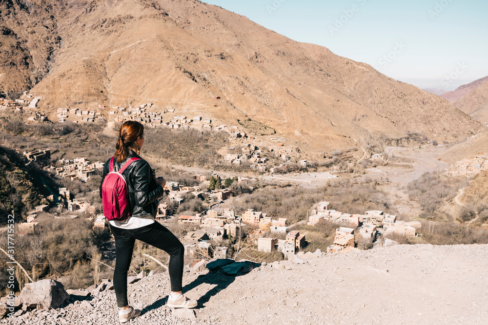 Young tourist hiking in the mountains of Morocco Young tourist hiking in the mountains of Morocco