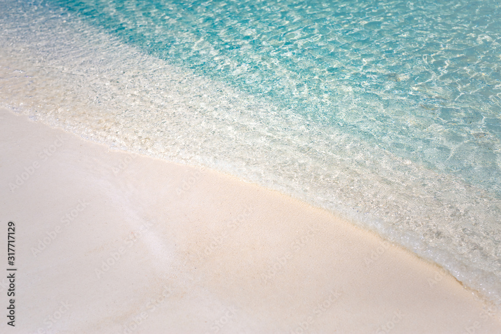 Peaceful beach nature. Soft blue ocean wave on clean sandy beach.  Soft beautiful ocean wave on sandy beach