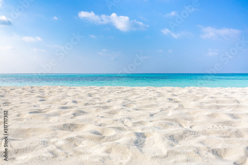 Fototapeta Naklejka Na Ścianę i Meble -  Sea sand sky. Empty tropical beach landscape, seascape. Minimal beach view. Peaceful nature concept, natural sunny weather