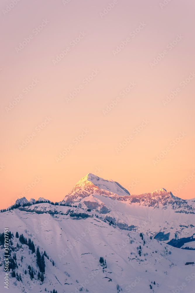 Mont Charvin and the Aravis mountain range at sunrise or dawn, view from the top of Megève, Haute-Savoie, France