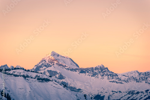 Mont Charvin (right) and the Aravis mountain range at sunrise or dawn, view from the top of Megève, Haute-Savoie, France