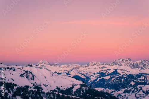 Mont Charvin (left) and the Aravis mountain range at sunrise or dawn, view from the top of Megève, Haute-Savoie, France