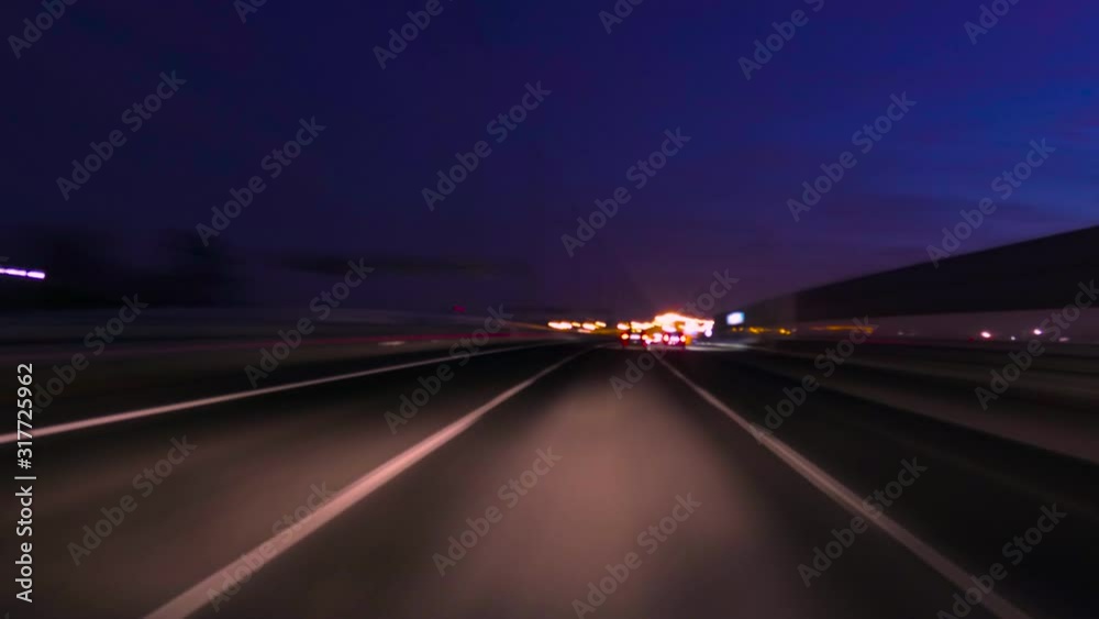Time Lapse Driving Car On Highway At Dark POV. Hyper Lapse. Evening Sunset Street Lights. Night, Camera In Front, Windshield Reference. Hyperlapse in Evening City, Downtown. POV Futuristic Cityscape. Time Lapse Driving Car On Highway At Dark POV. Hyper Lapse. Evening Sunset Street Lights. Night, Camera In Front, Windshield Reference. Hyperlapse in Evening City, Downtown. POV Futuristic Cityscape.