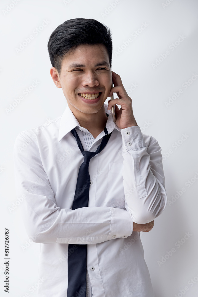 One asian business man hold hand phone,show feeling face smile,happy,agree, Man may have business success,life no problem. One asian business man hold hand phone,show feeling face smile,happy,agree, Man may have business success,life no problem.