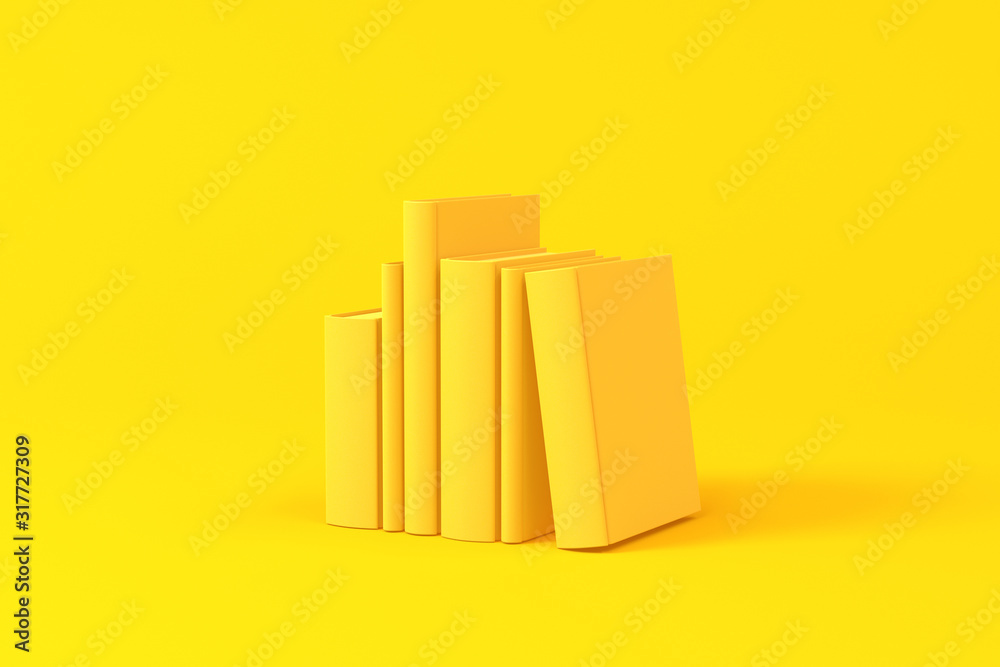 Books isolated over a yellow background. Minimalist concept.