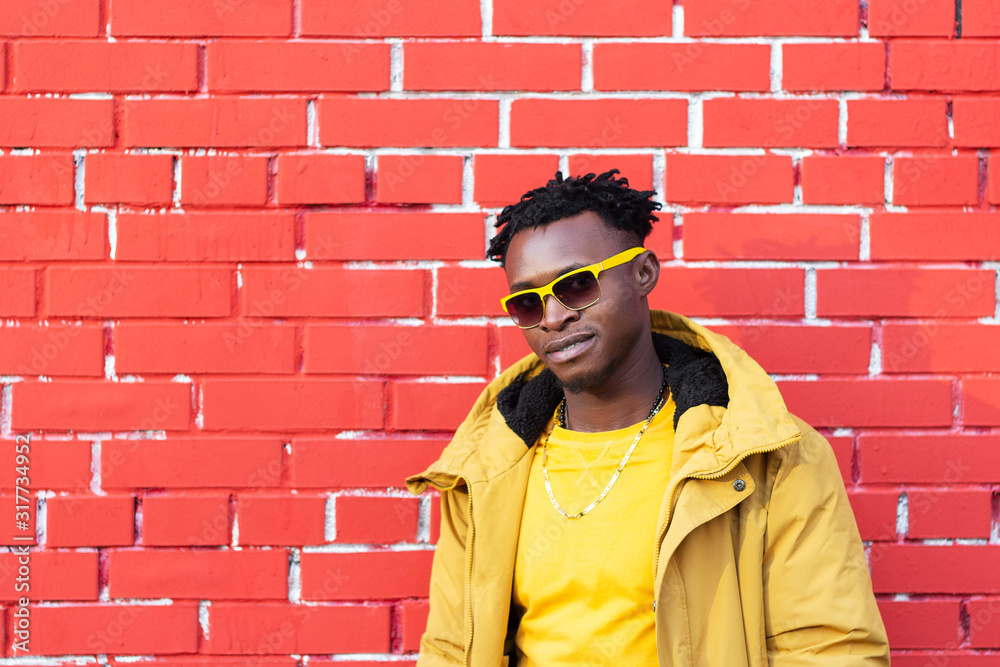 African American man stylish fashionable on trend . contrast color yellow red African American man stylish fashionable on trend . contrast color yellow red