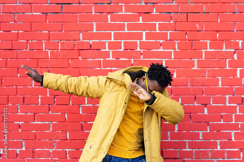 African American man dance movement dab success and luck.color contrast photo