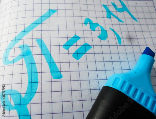 The number pi is written in a notebook with a pen or marker. Pi day number concept. pi is 3.14