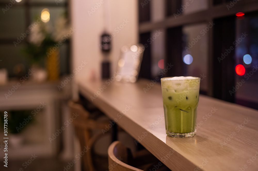 iced green tea with milk put on wooden table iced green tea with milk put on wooden table