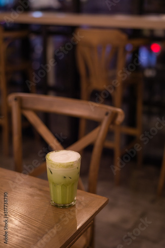 iced green tea with milk put on wooden table