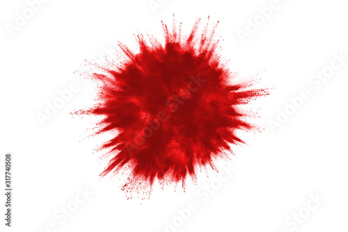 Launched red powder on white background. © piyaphong