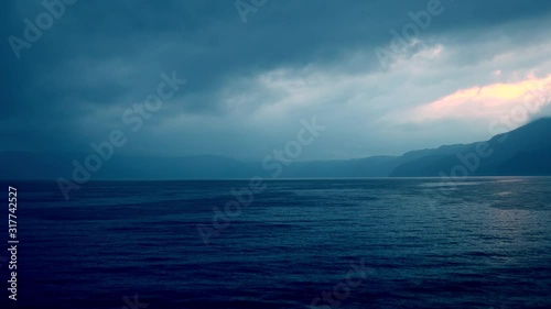 Dramatic stormy sky over lake photo