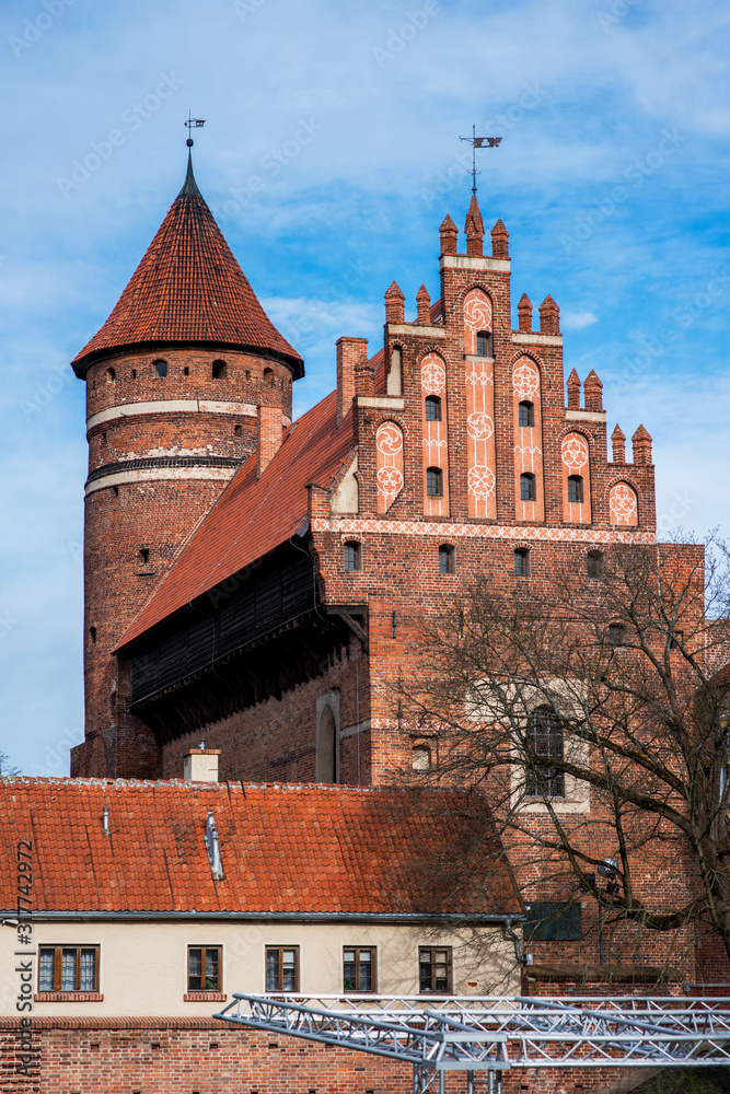 Olsztyn Gothic castle seat of astronomer Nicolaus Copernicus on a sunny day against the sky