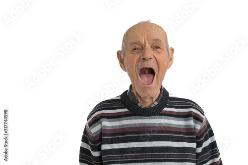 Handsome old man in casual clothes showes his mouth without teeth isolated over white background, need a dentist, copyspace