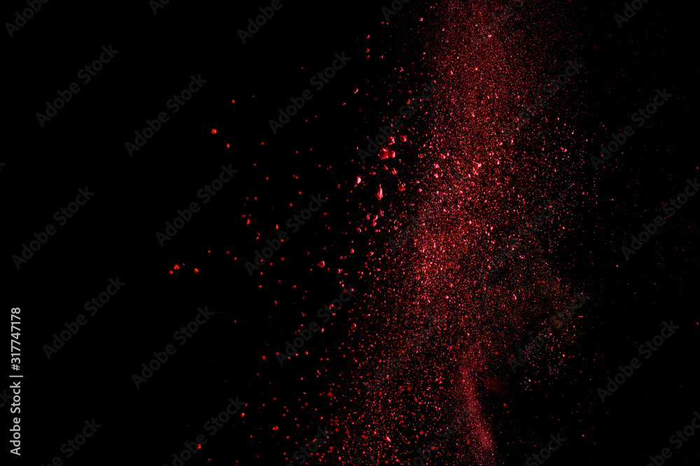 red colorful holi paint explosion on black background
