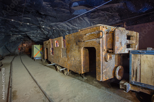 Gold mine underground tunnel with electric locomotive