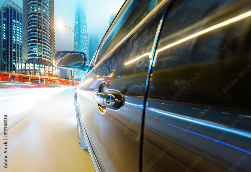 Fototapeta premium speeding car go through the city