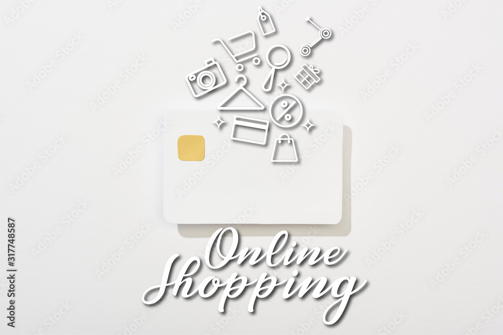 top view of empty credit card on white background with online shopping illustration