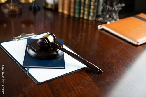 Law and justice theme, judge's gavel on court library background