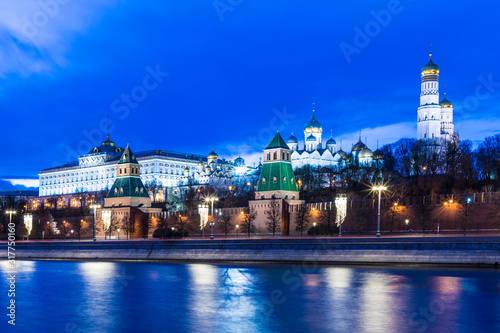 Illuminated Moscow Kremlin with Grand Kremlin Palace the government residence of president of Russia. View from the embankment of Moskva river. Evening urban landscape in the blue hour