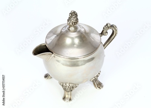 Antique silver bowl for milk on the white background