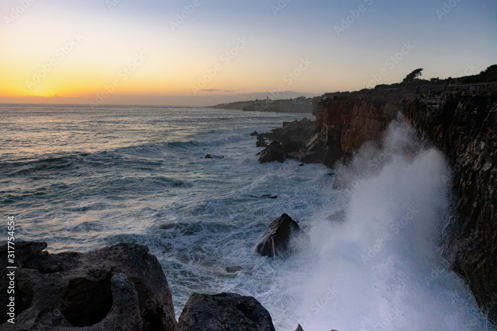 waves crush on the rock. Cascais, Portugal