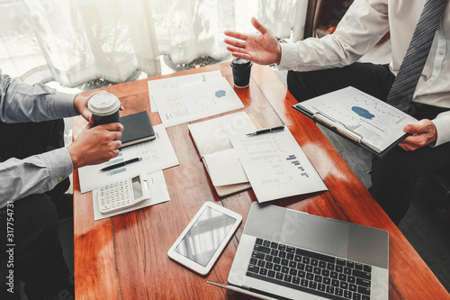 Business team meeting Strategy Planning with new startup project plan Finance and Economy Graph with laptop successful teamwork