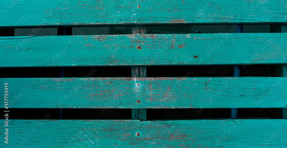 Green painted wooden fence, background or texture.
