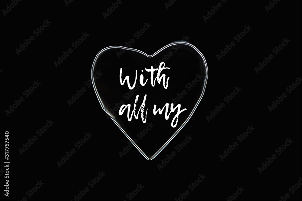 Top view of metal wire in heart shape isolated on black with all my illustration