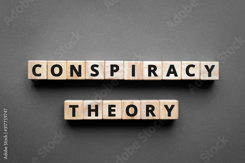 Foto Conspiracy theory - words from wooden blocks with letters, a secret plan powerfu