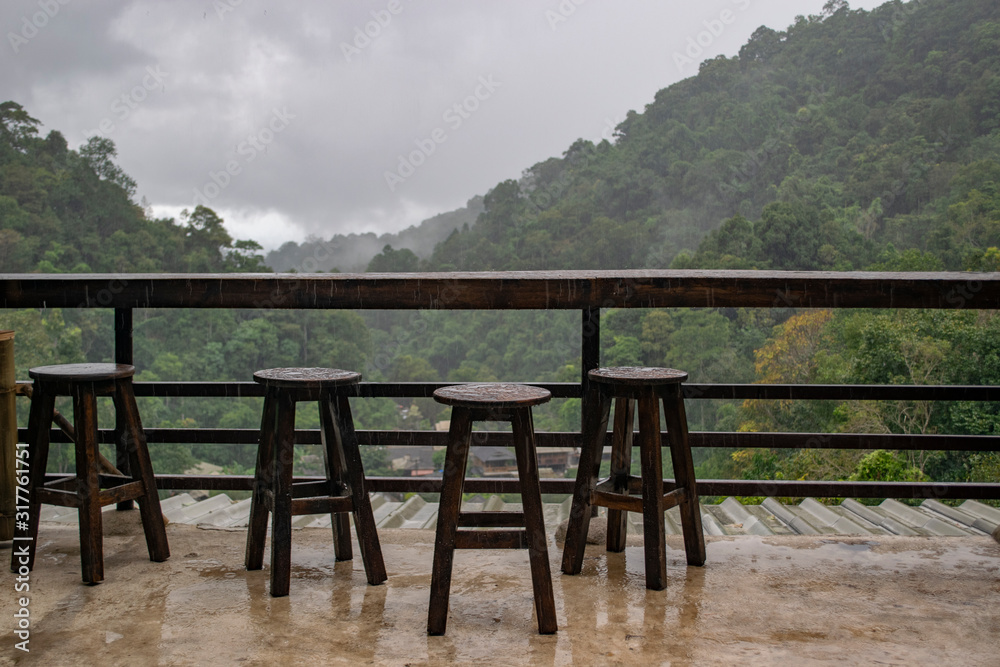 Rainy chairs on the mountain terrace