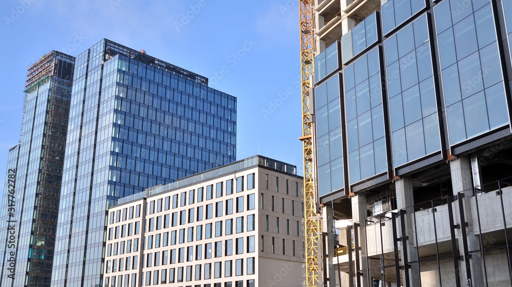 Building and construction scene. Skyscraper during construction in progress at sunny afternoon. Building and construction scene. Skyscraper during construction in progress at sunny afternoon.