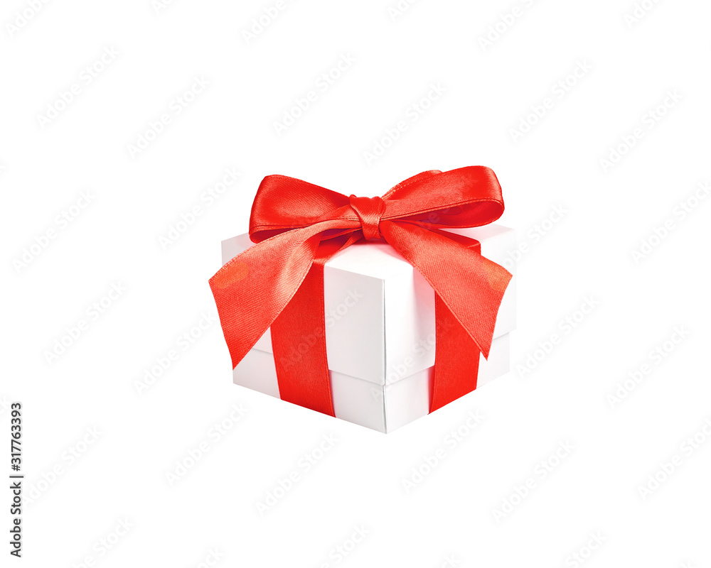 Handmade white paper box with red satin ribbon and bow on an isolated white background. Handmade white paper box with red satin ribbon and bow on an isolated white background.