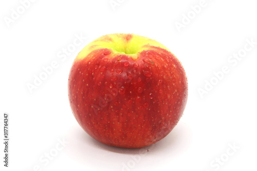 The fruit is a red and yellow Apple on a white background. Great tasty snack.