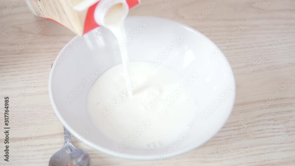 Milk is poured into a plate Milk is poured into a plate