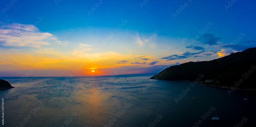 aerial view sunset above Nai Harn beach. Nai Harn beach is a famouse landmark and popular sunset viewpoint of Phuket Thailand